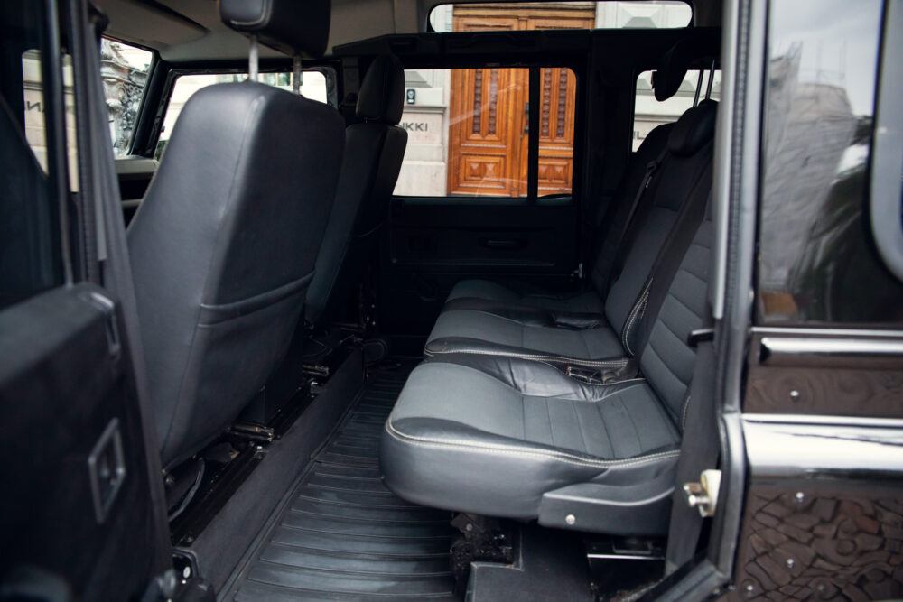Interior view of an open van with black seats
