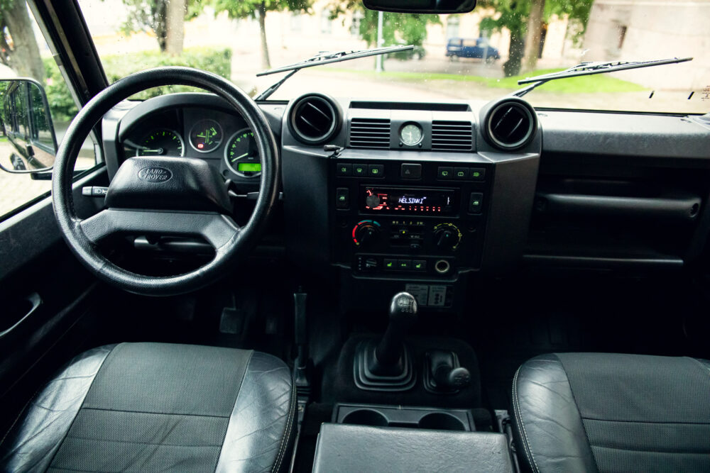 Interior view of a Land Rover with dashboard and seats