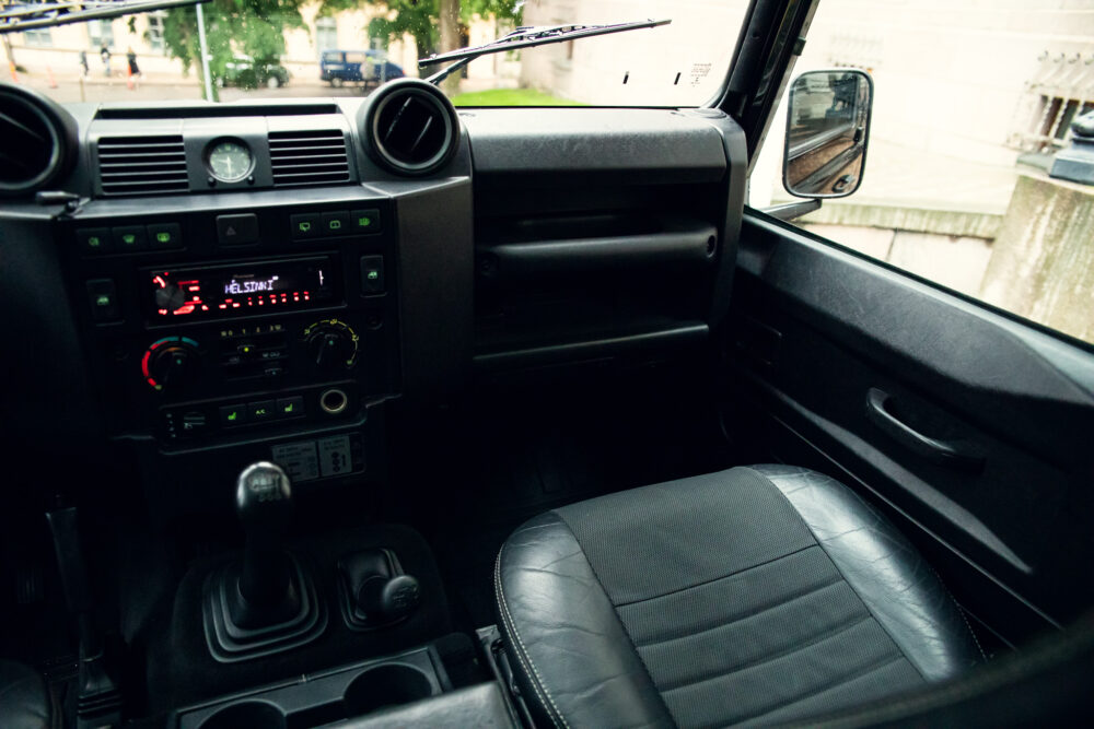 Interior view of modern vehicle dashboard and front seats