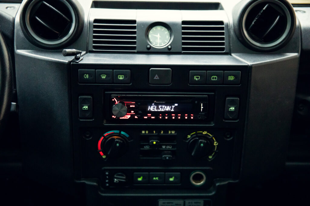 Car dashboard with visible radio and climate controls