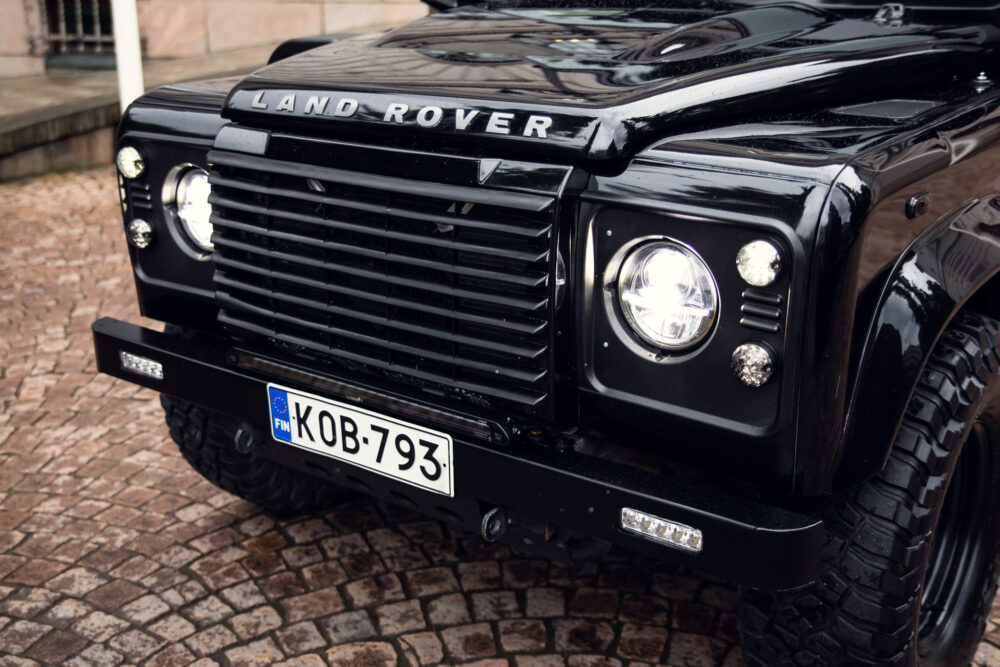 Close-up of a black Land Rover with Finnish license