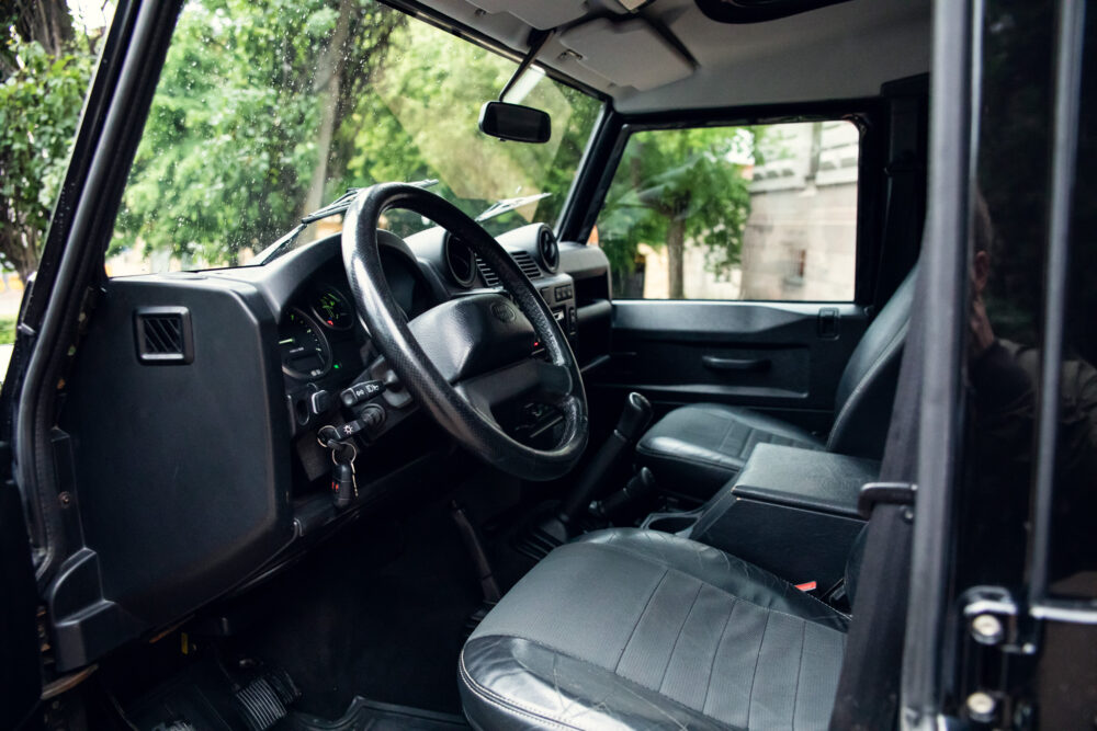 Interior view of an SUV showing steering wheel and dashboard.