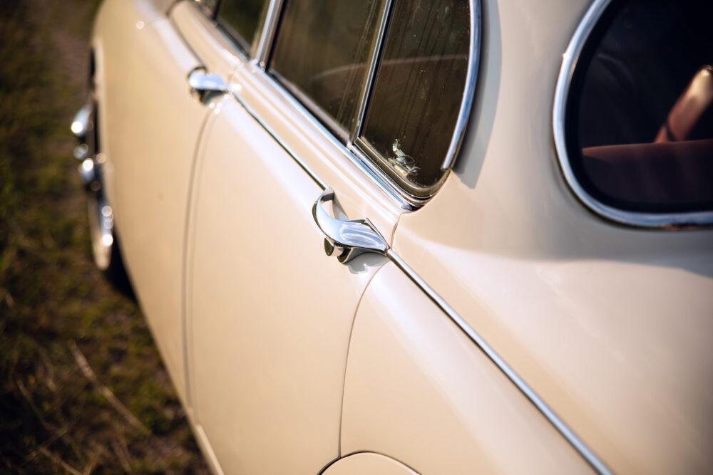 Vintage car side view, chrome handle and detailing