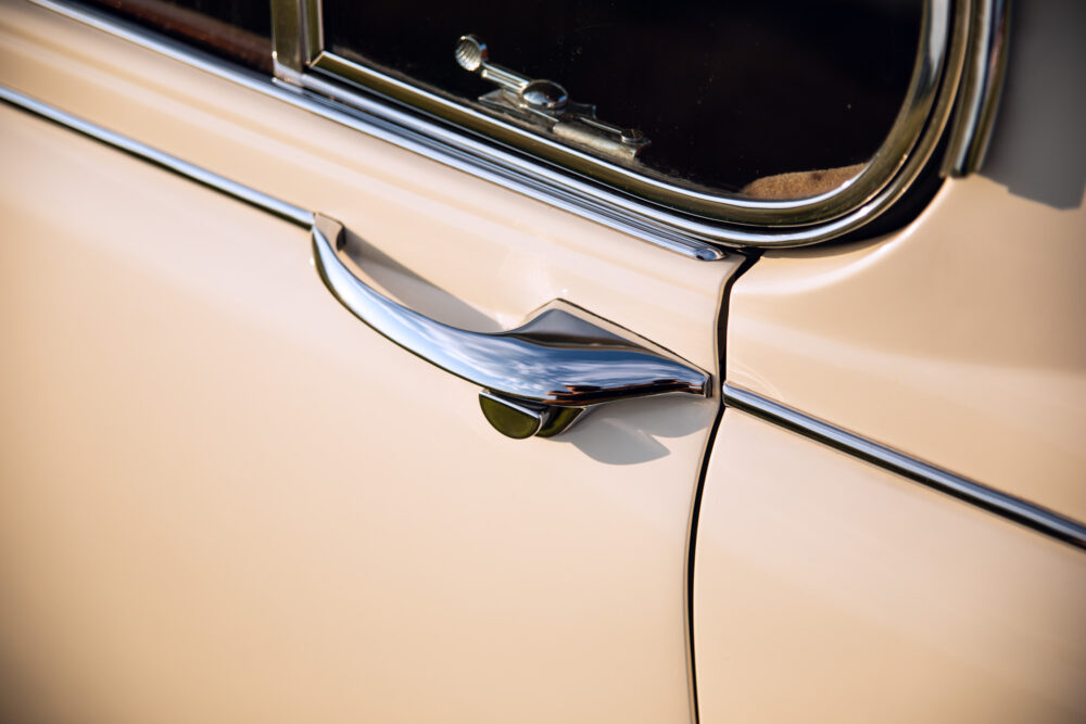 Close-up of vintage car chrome handle