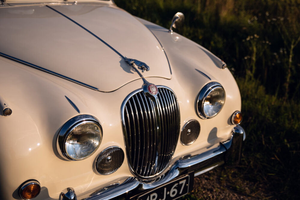 Vintage Jaguar car front view at sunset