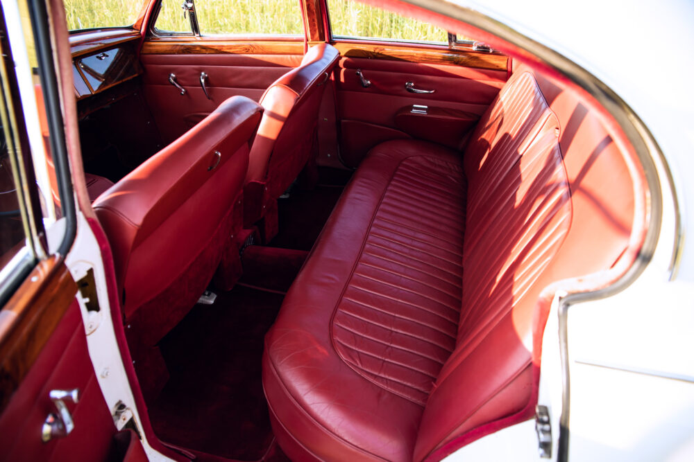 Vintage car red leather interior through open door