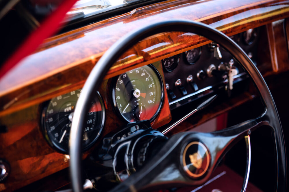 Vintage car dashboard with wooden panel and gauges
