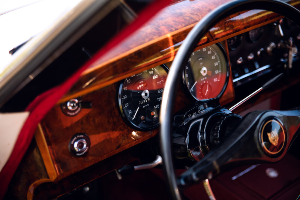 Vintage car dashboard with wooden panel and gauges