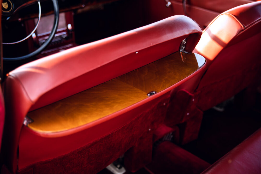 Vintage red car interior with wooden dashboard