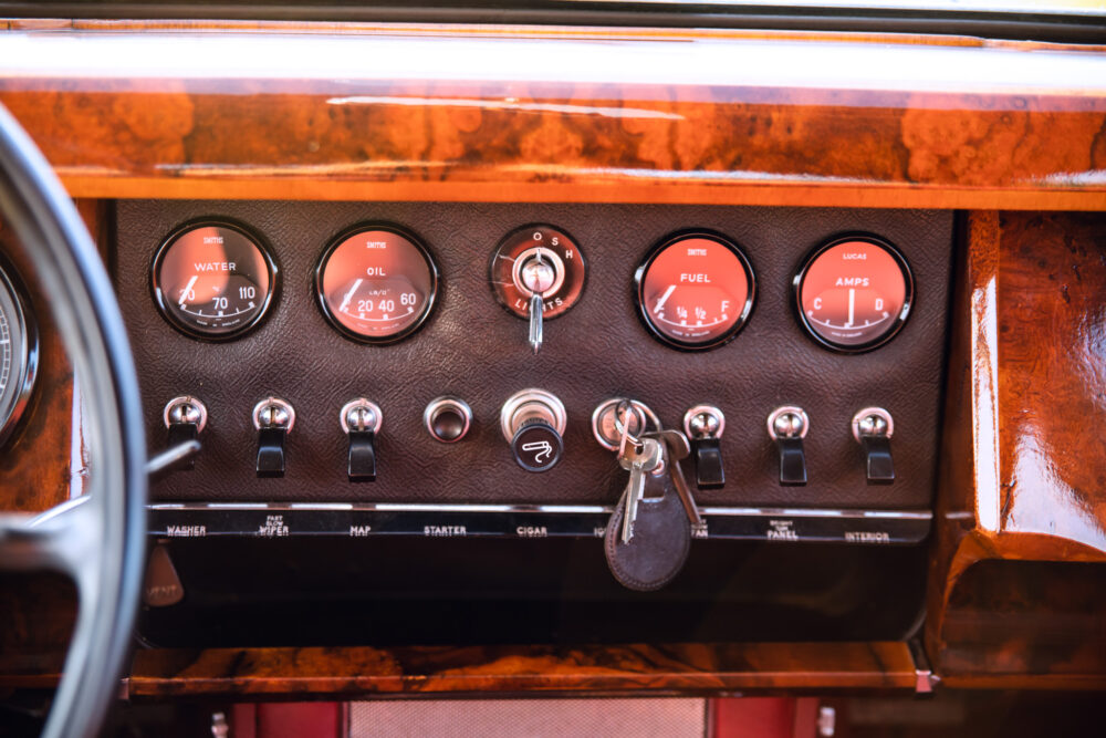 Vintage car dashboard with gauges and ignition keys