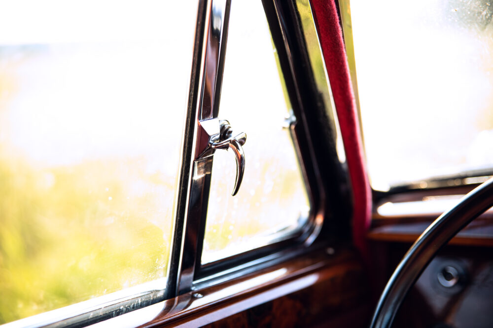 Vintage car window and detailed wooden interior
