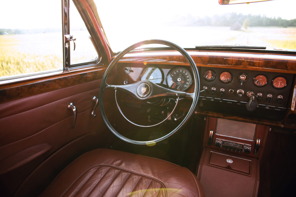 Vintage car interior with steering wheel and dashboard