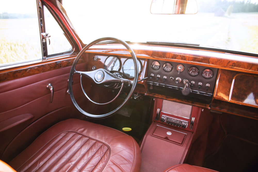 Vintage car's luxurious interior with wooden dashboard