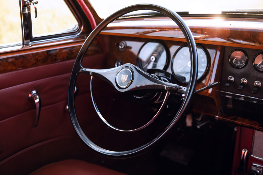 Vintage car dashboard with elegant steering wheel