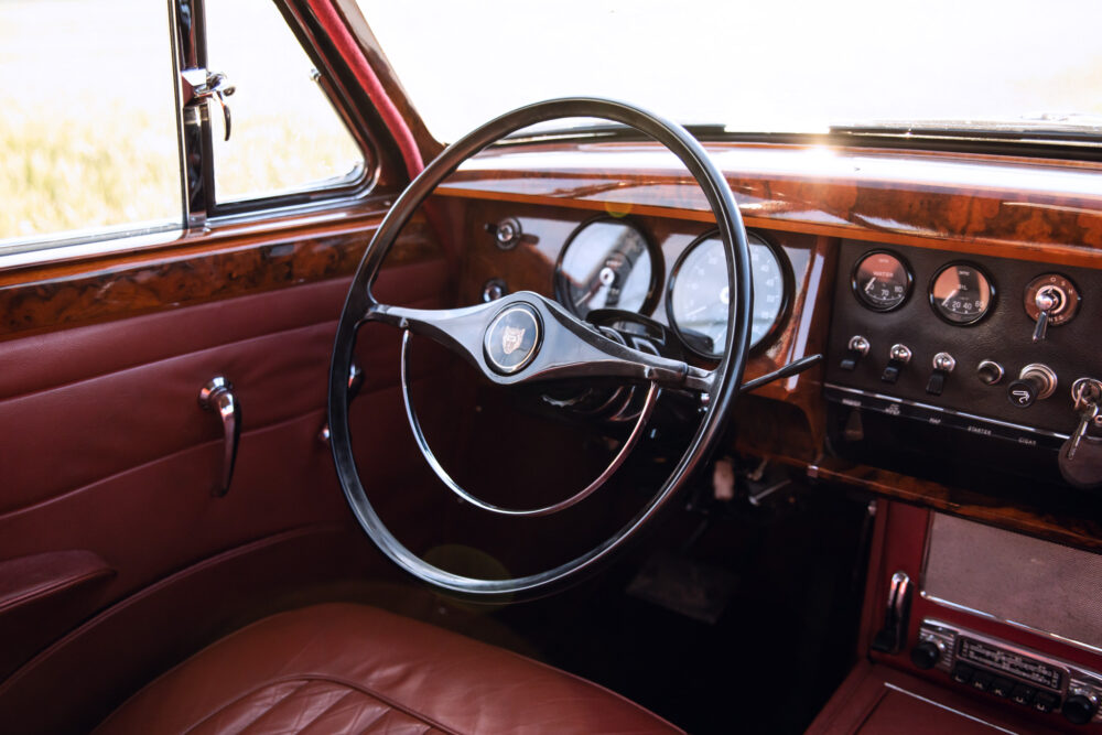 Vintage car interior with elegant wooden dashboard