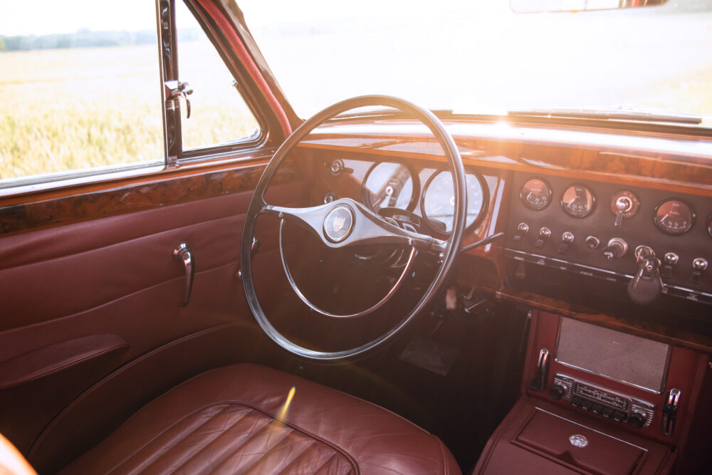 Vintage car interior with steering wheel and dashboard