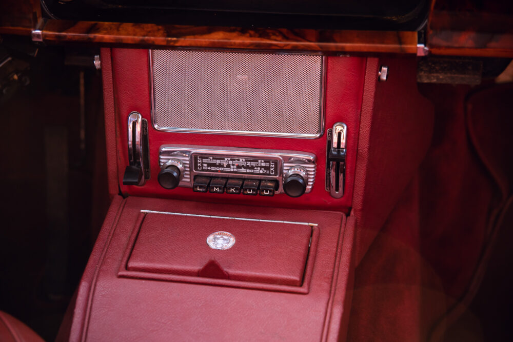 Vintage car red leather interior with classic radio