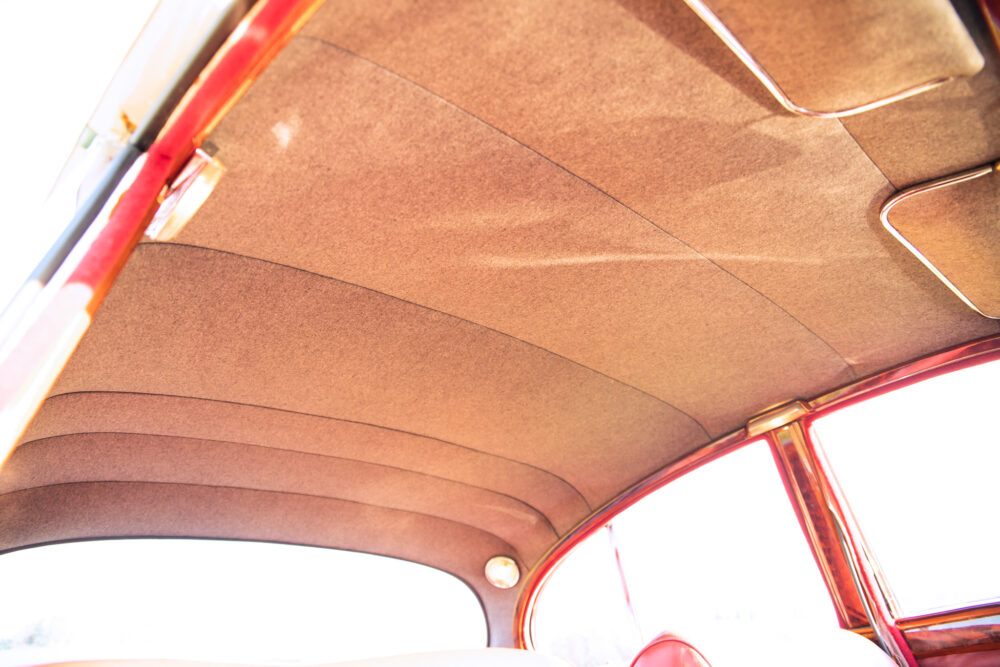 Vintage car's plush tan interior ceiling