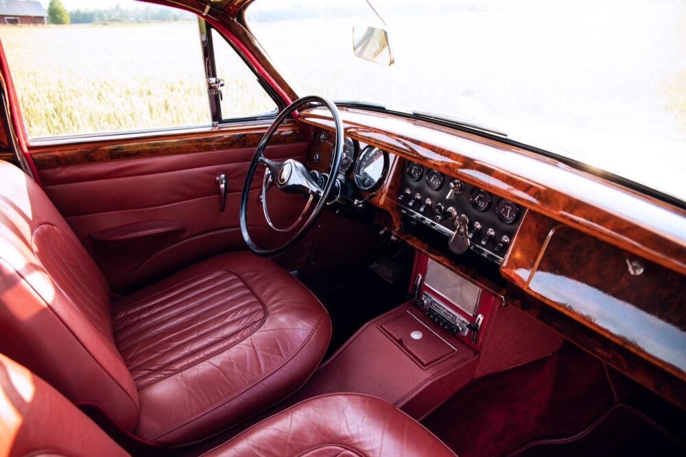 Classic car interior with red leather seats and dashboard