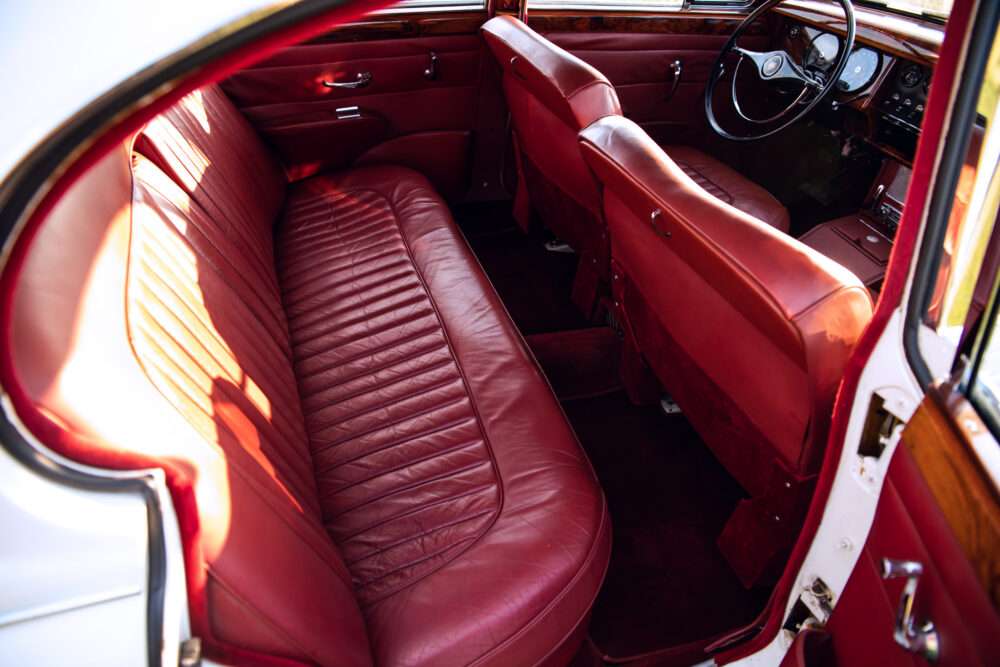 Vintage car red leather interior with classic dashboard