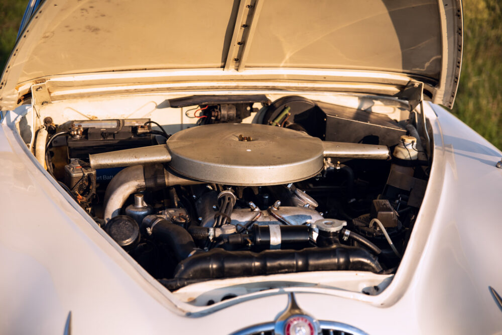 Vintage car engine under open hood