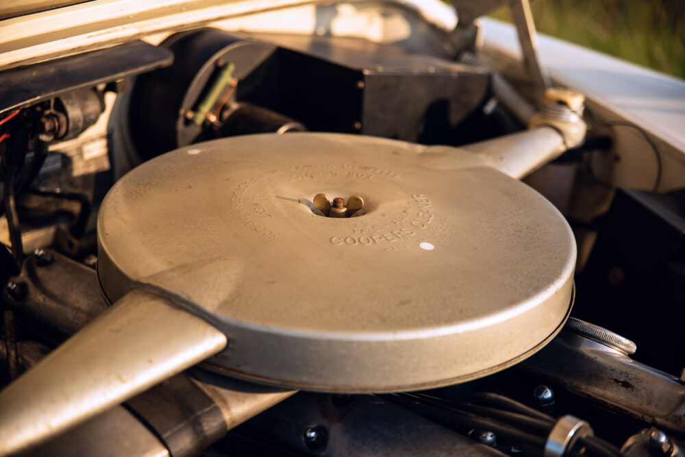 Vintage car's engine with labeled air filter cover