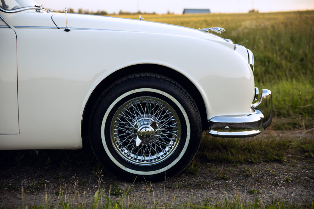 Close-up of vintage car's wheel and fender