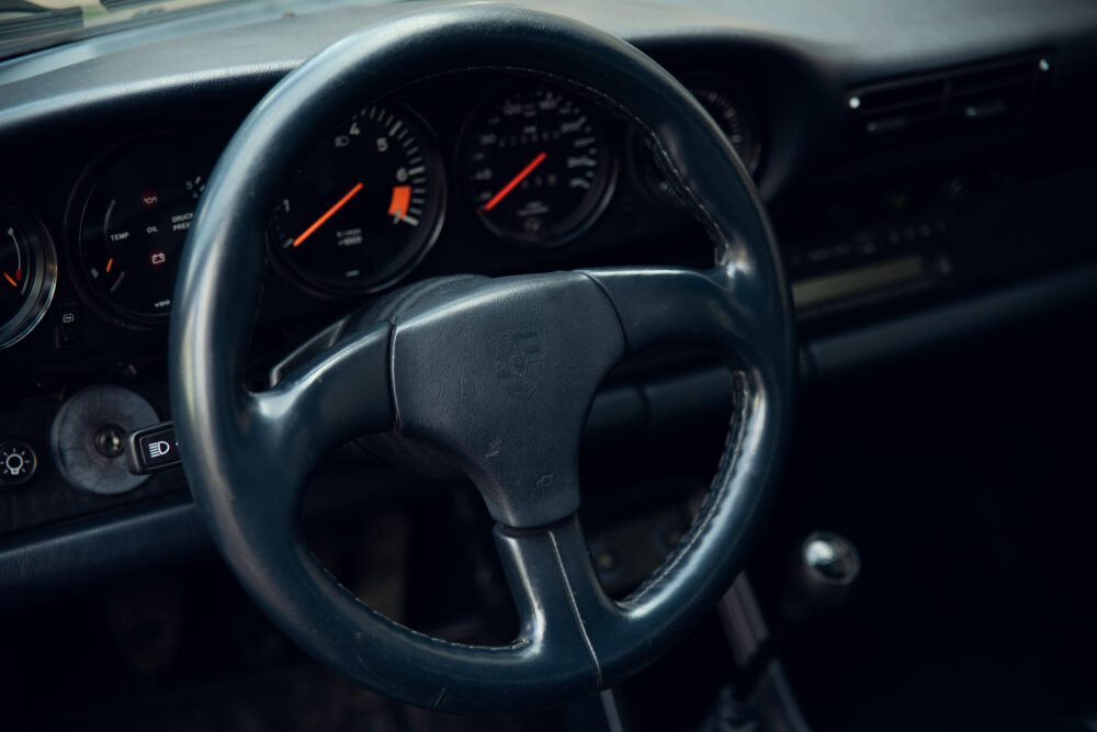 Vintage car dashboard and steering wheel close-up