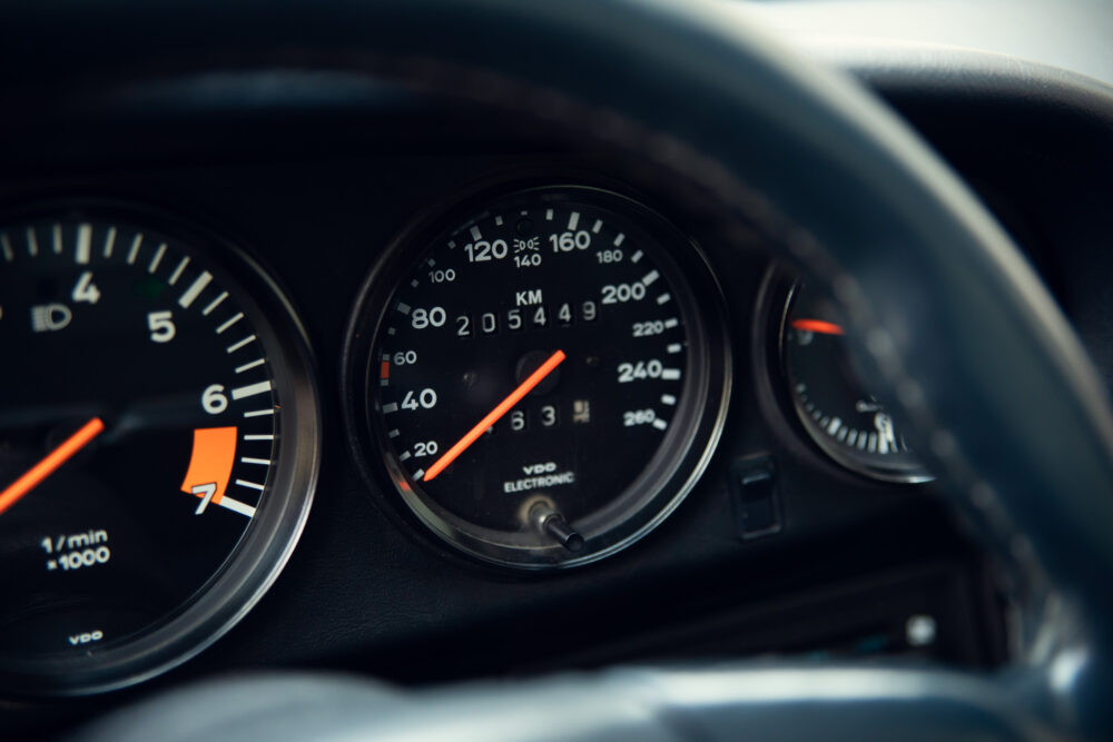 Close-up of car speedometer showing kilometers per hour