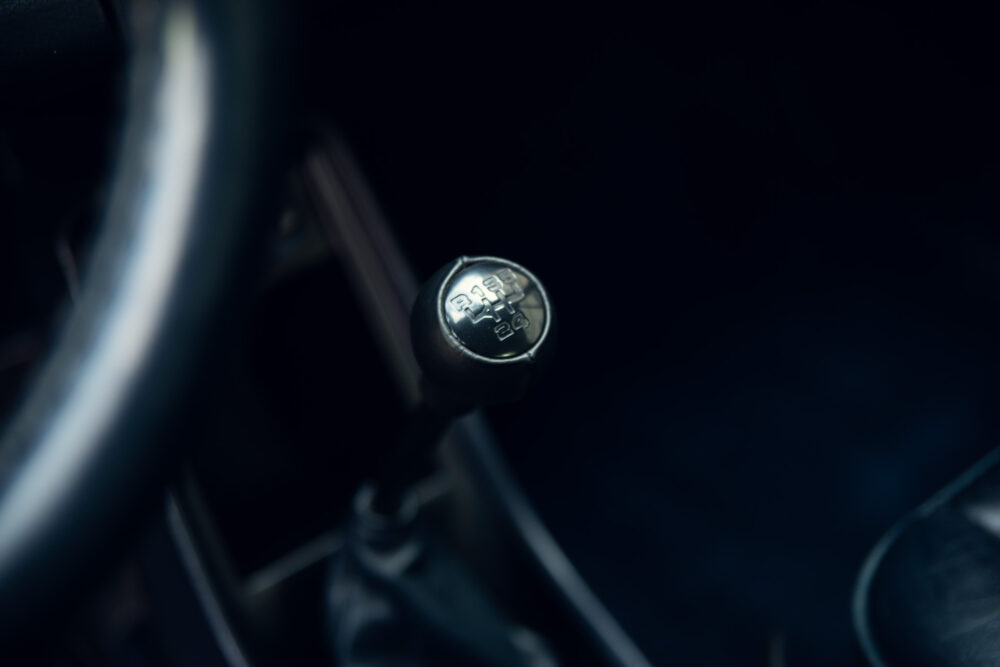 Close-up of a car's manual gear shift lever