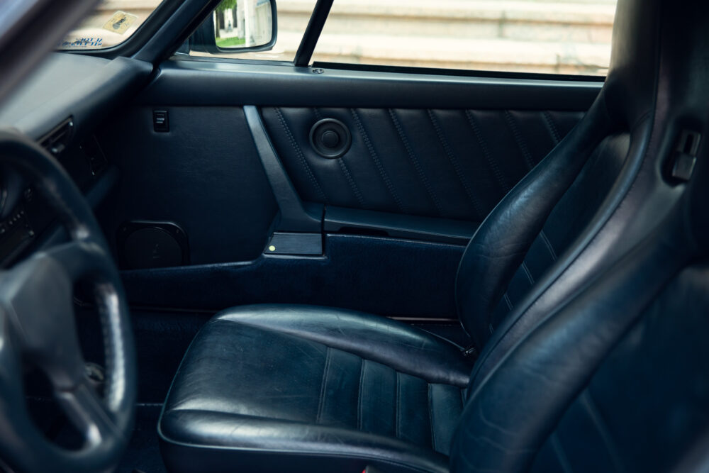 Vintage car interior with leather seats and dark dashboard