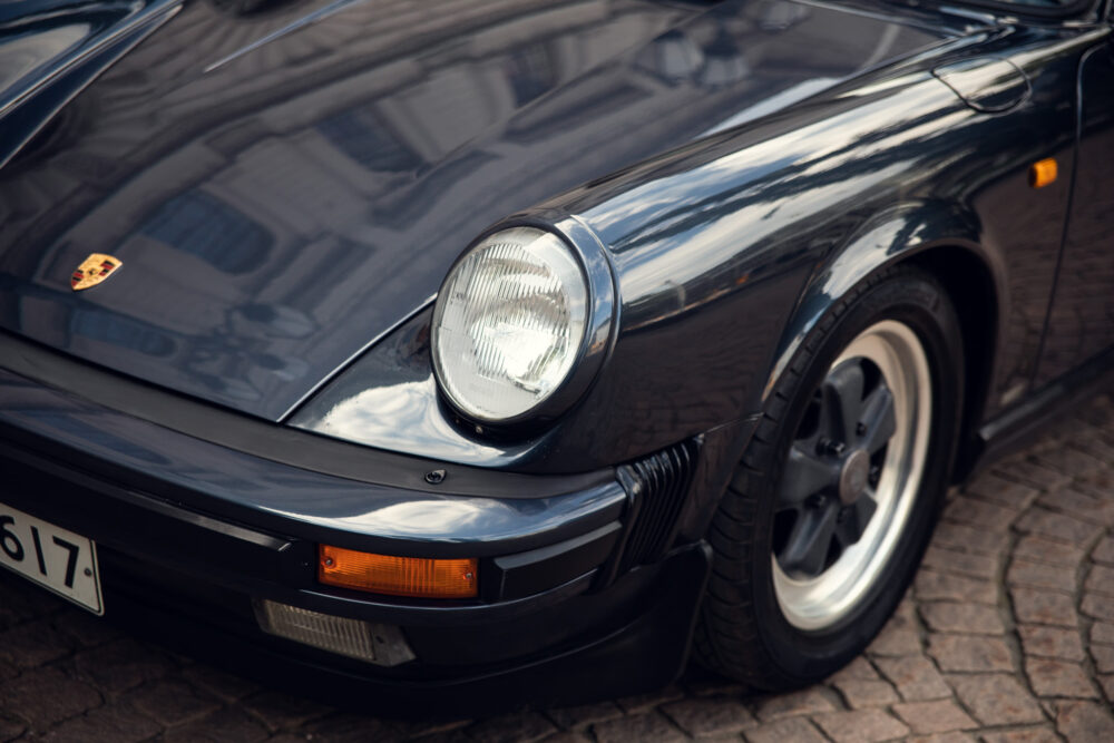 Vintage Porsche 911 front close-up on cobblestone street