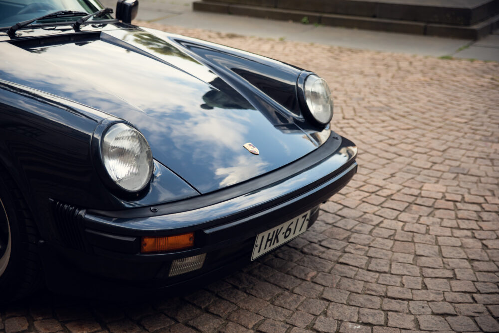 Vintage Porsche black on cobblestone street