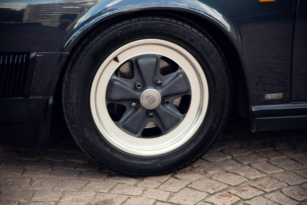 Classic car wheel with white sidewall tire