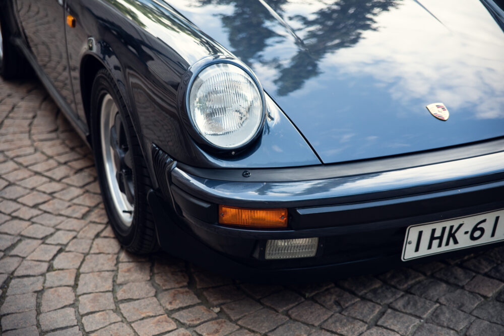Close-up of a classic black Porsche's front end