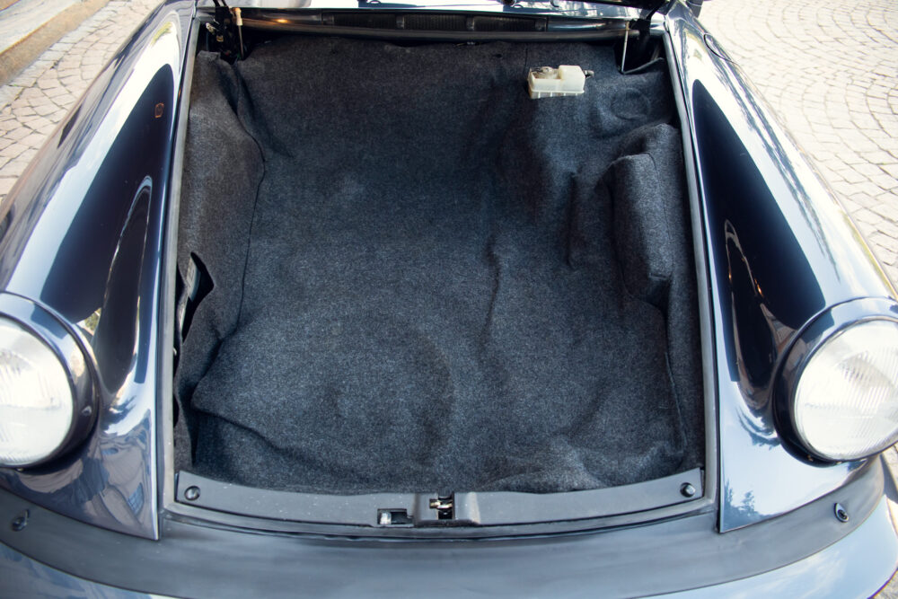Open trunk of a classic car showing spacious interior