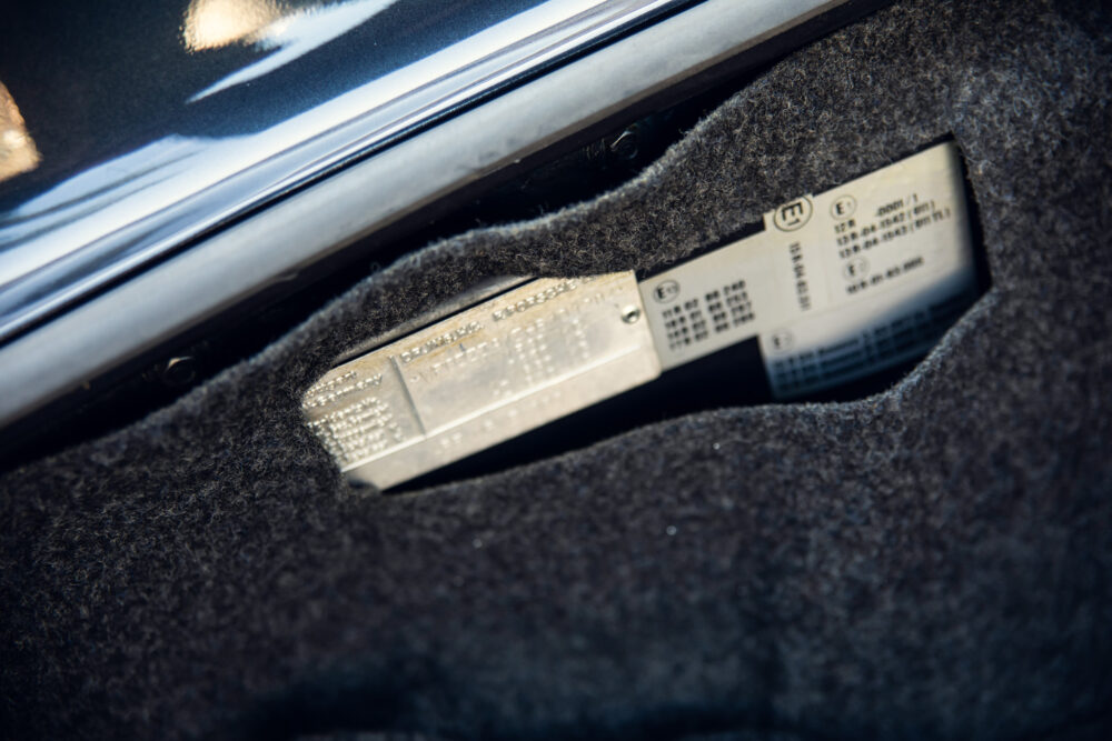 Car identification labels inside open vehicle door