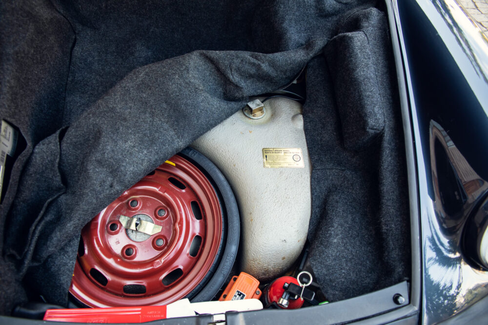 Car trunk with spare tire and tools