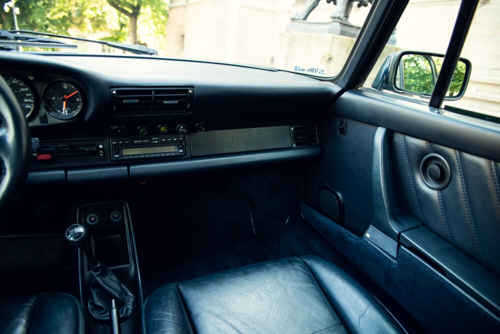 Vintage car interior with manual transmission and leather seats