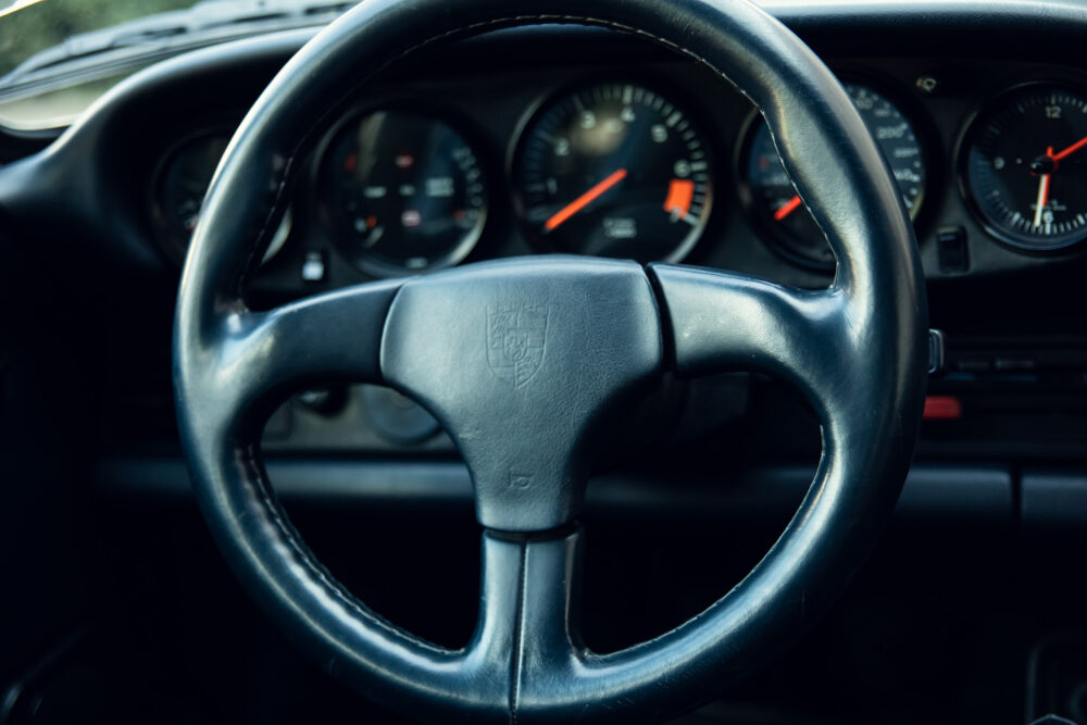 Close-up of Porsche steering wheel and dashboard
