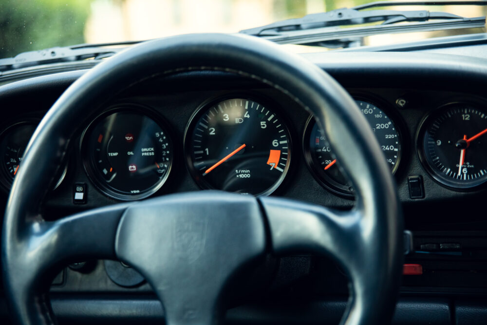 Close-up of car dashboard with speedometer and gauges
