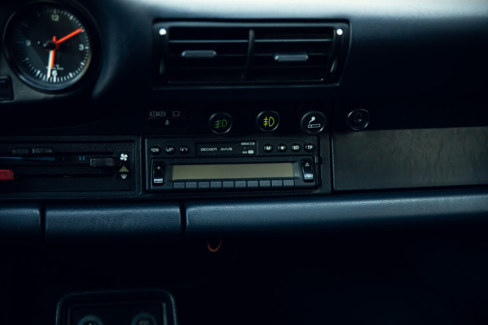 Classic car dashboard with clock and radio controls