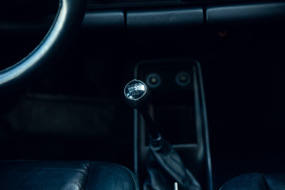 Dark interior view of car's manual gear shift