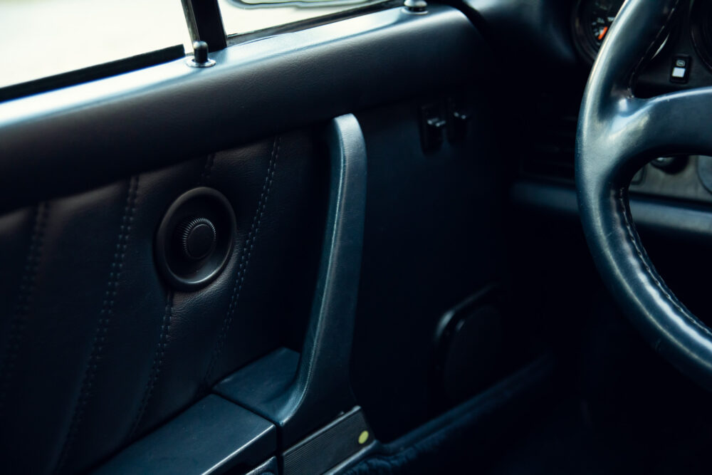 Close-up of car interior with steering wheel