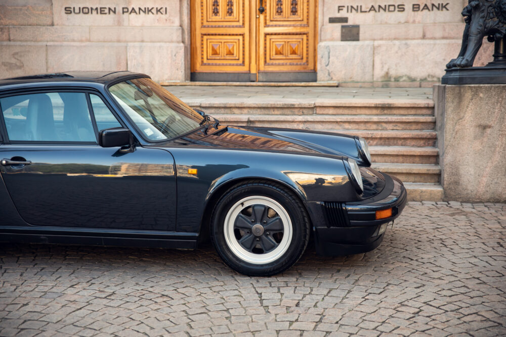 Vintage black Porsche outside Finland's Bank in Helsinki