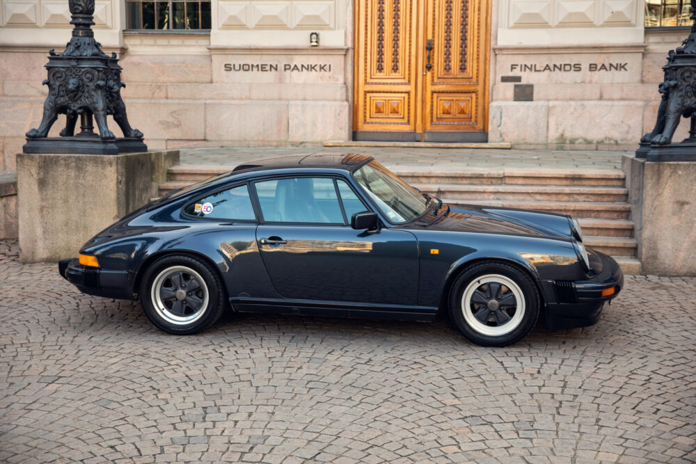 Vintage Porsche car parked outside Finland's Bank