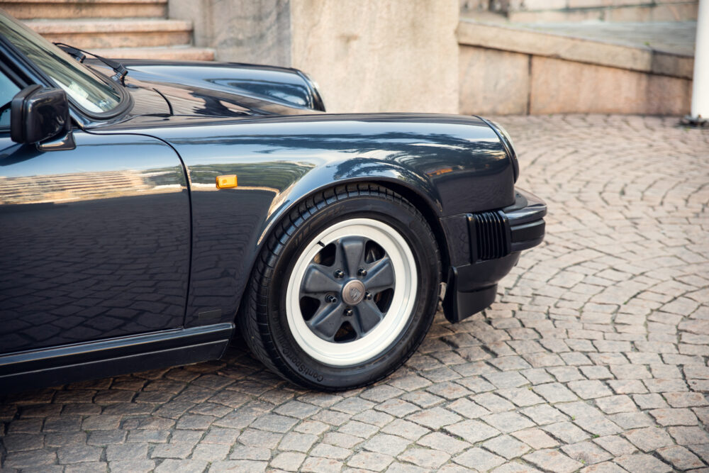 Close-up of a classic black sports car parked