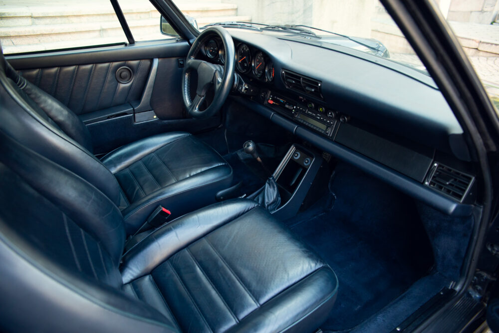 Vintage car interior with black leather seats