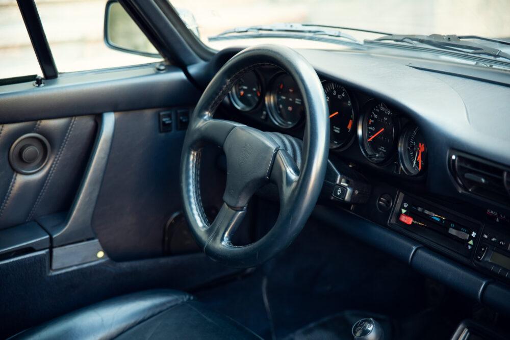 Vintage car dashboard and steering wheel close-up