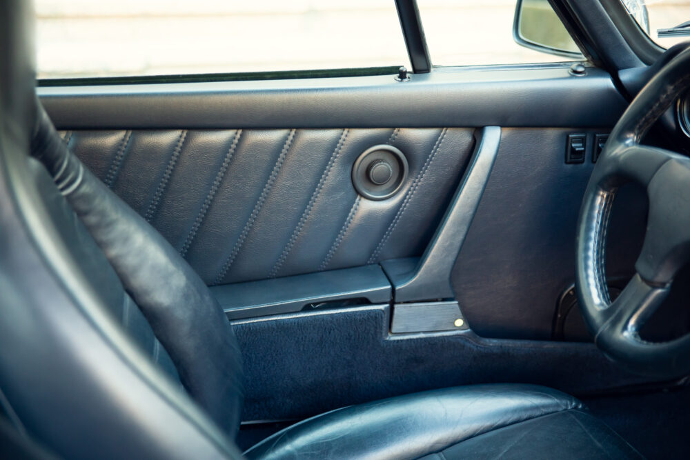 Vintage car interior with leather seats and steering wheel